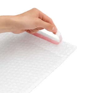 Clear self-seal bubble bag being opened to show the protective air cushioning and adhesive strip.